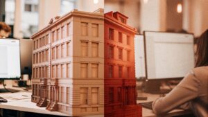 Split-view image showing a realistic 3D architectural model on the left side and a digitally rendered version of the same building on the right, with architects working at computer stations in the background, illustrating the use of digital twin technology in architectural design.