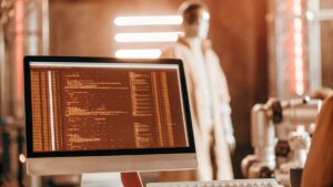 Futuristic workspace with code editor on screen, showcasing programming environment in 2025