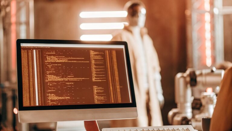 Futuristic workspace with code editor on screen, showcasing programming environment in 2025